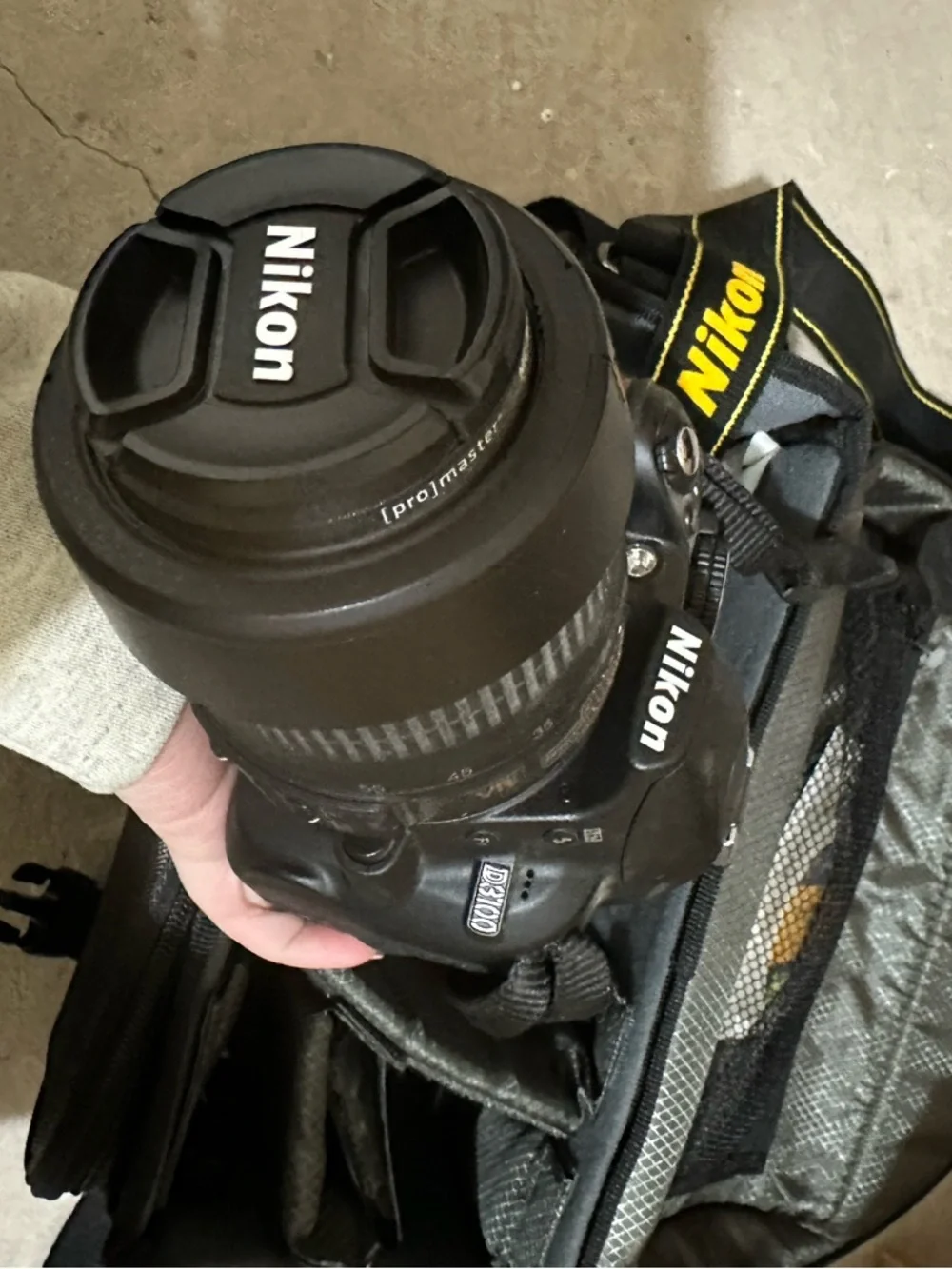 Nikon D3100 DSLR Camera Kit in Black and Yellow-Accented Strap